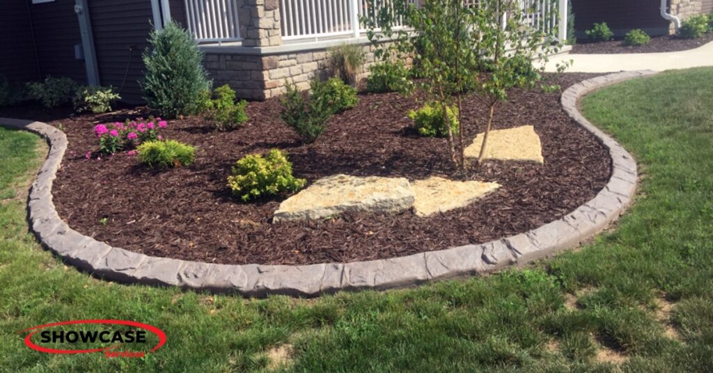 Custom concrete curbing with decorative stamped finish in Minnesota yard