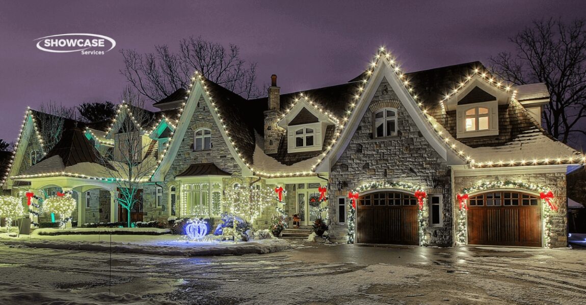Professional installing Christmas lights on a home in the Twin Cities