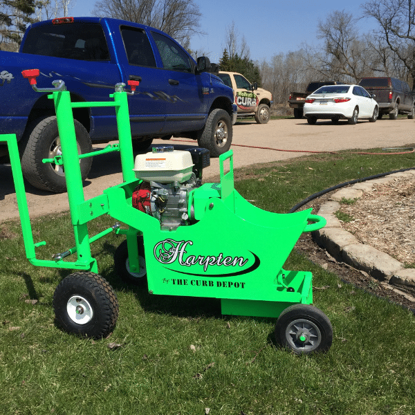 3 A contractor installing concrete curbing in a residential landscape