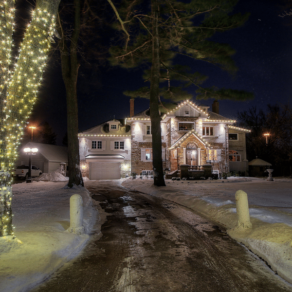 Messy DIY Christmas light cords next to neatly arranged professional lights.