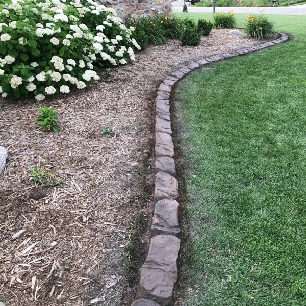 Concrete Edging Compared to Other Landscape Borders Side-by-side comparison of concrete, metal, and plastic edging types